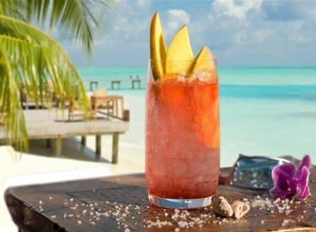 Beach with palm tree and cocktail